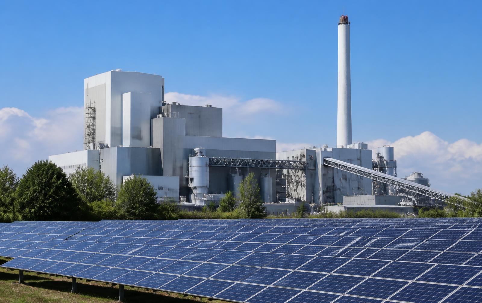 Waste-to-energy facility with a solar array in the foreground